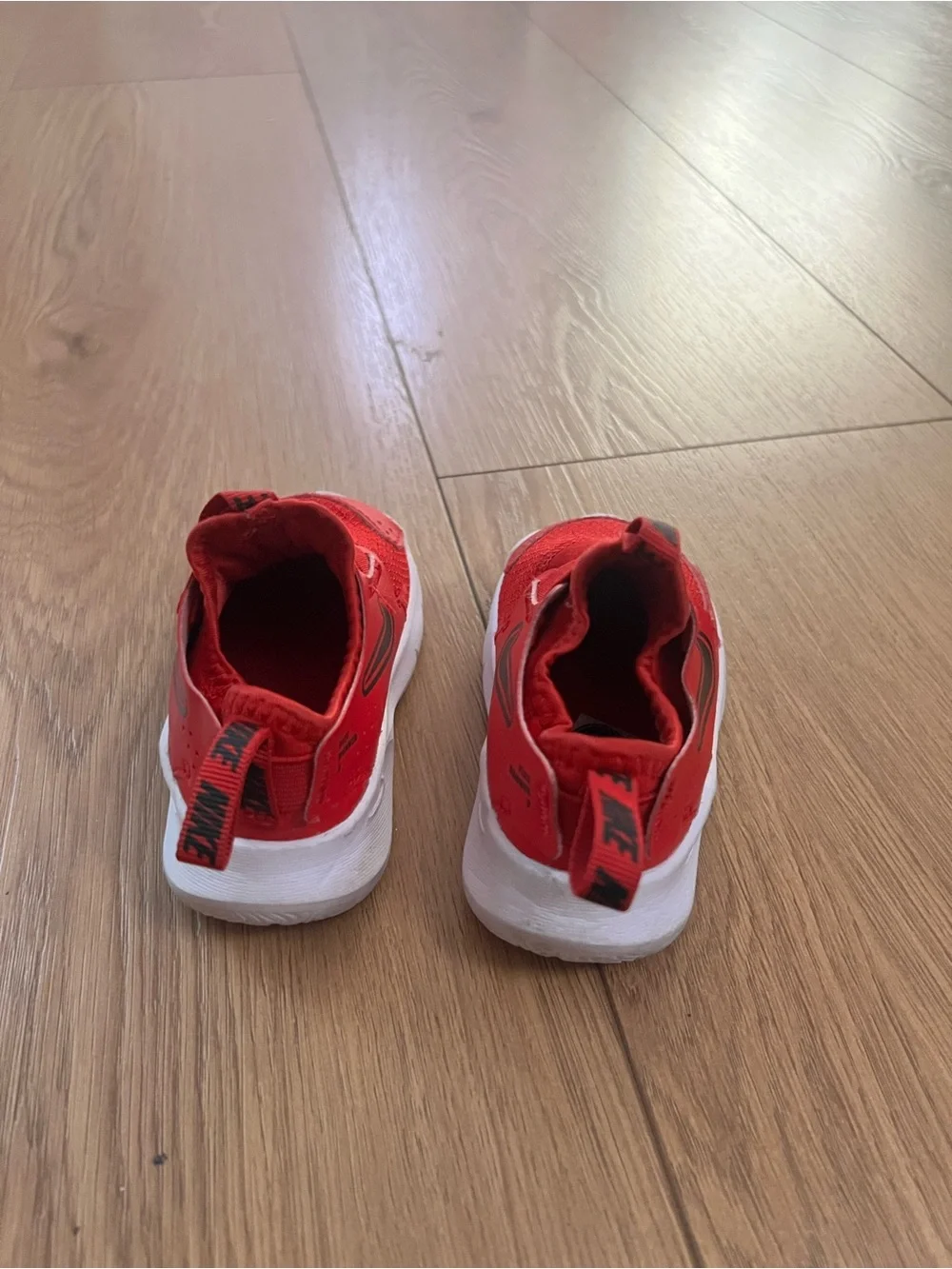 Nike Kids Red Slip-On Sneakers with Black Swoosh